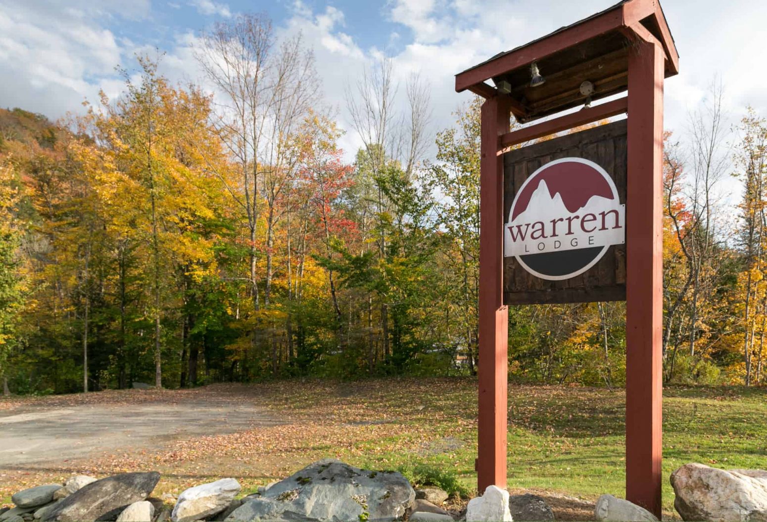 Vermont hotel sign Warren Lodge in Mad River with fall trees