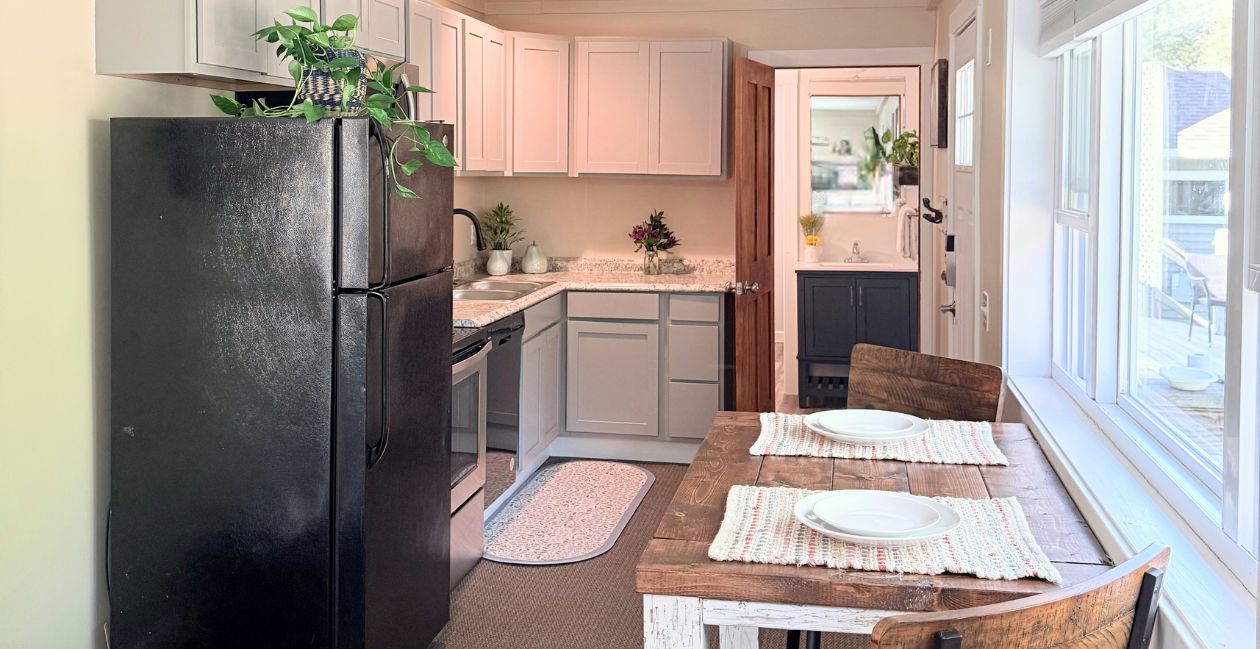 A full kitchen and bar height dining table for two in the Riverside studio at Warren Lodge in VT
