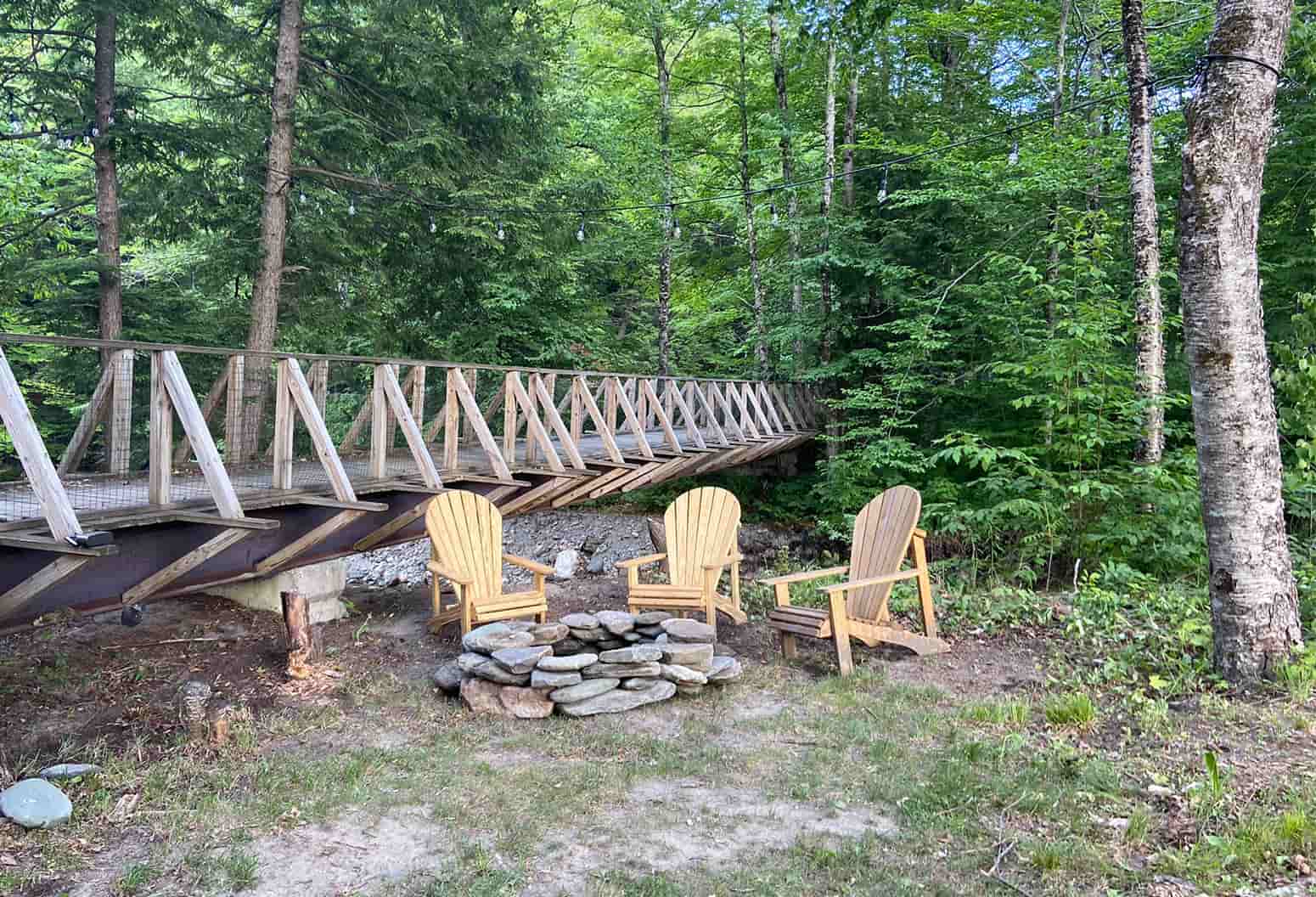 Fire Pit with adirondack chairs in Warren Lodge Backyard